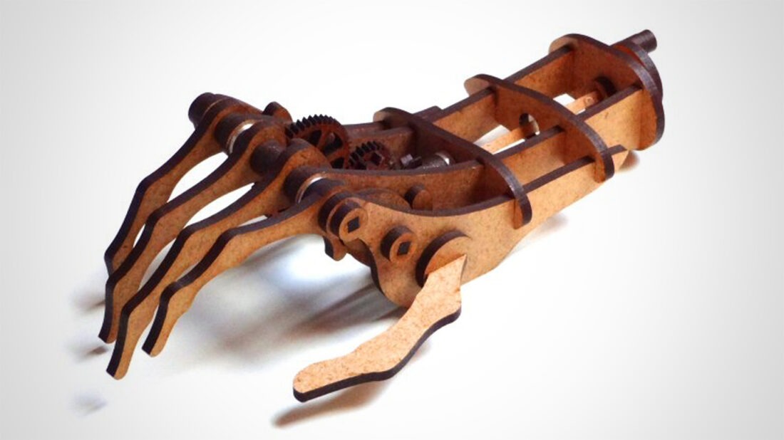 This Laser Cut Mechanical Hand is the Perfect Desk Toy for a Mechanical