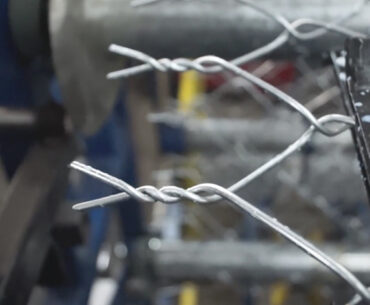 Watch a Chain Link Fence Get Weaved Like a Giant Metal Sweater