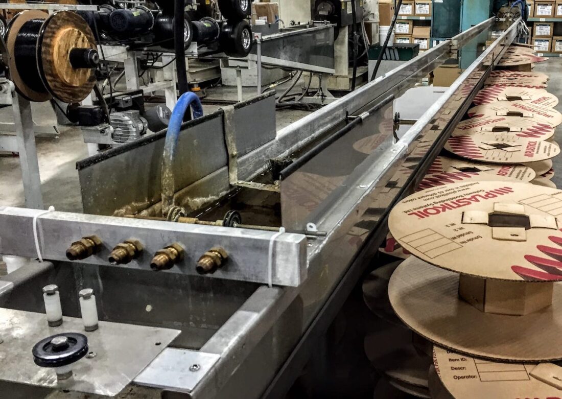 A typical water cooling trough used to produce 3D printer filament.