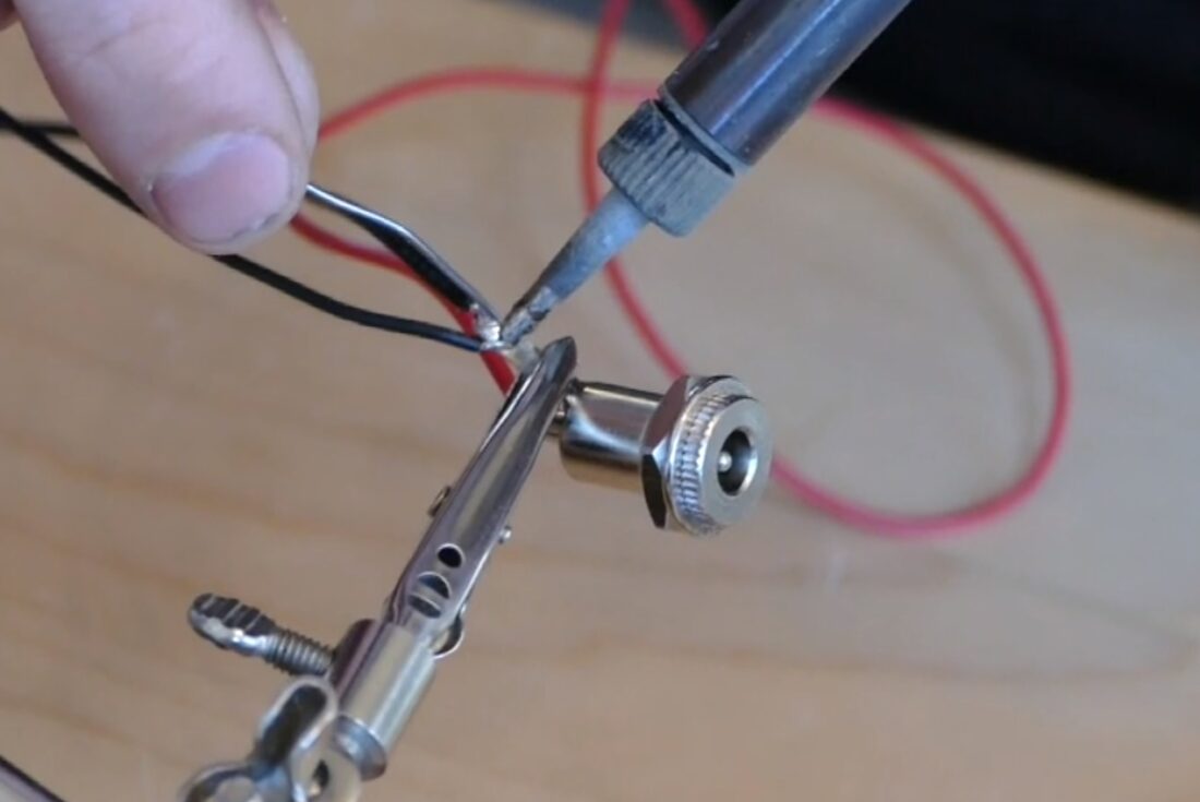 Soldering that 2nd wire to the same negative terminal of the power jack.