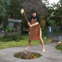 wooden axe out of tree stump