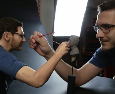 Artist Makes a Bust of Himself Working on a Smaller Figure of Himself self-portait sculpture