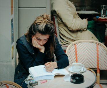 woman in black jacket sitting on chair