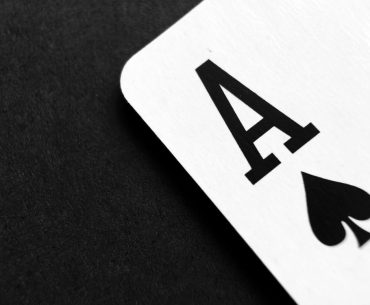 Free Ace of Spade Playing Card on Grey Surface Stock Photo