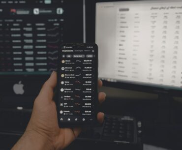 Crypto Market – The Market of Endless Possibilities person holding black android smartphone