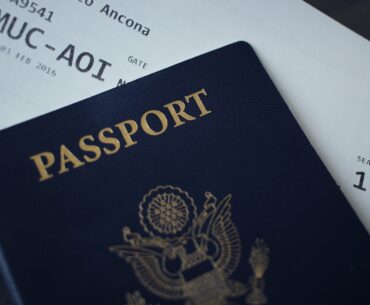 passport booklet on top of white paper