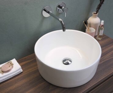 white ceramic sink with stainless steel faucet
