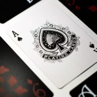 spade playing card on white surface