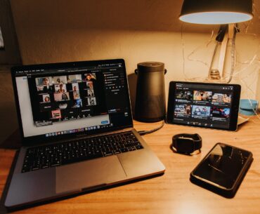 black and silver laptop computer on brown wooden table