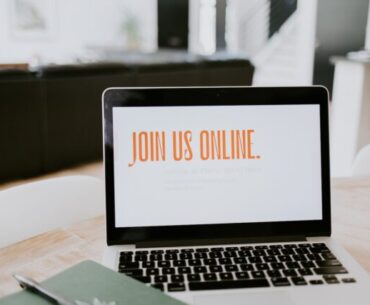 macbook pro on brown wooden table
