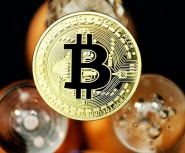 Why Does Bitcoin Have Such a High Market Value? gold and black star print round ornament