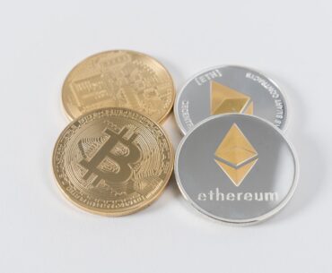 How to be a Successful Crypto Trader? four round silver-colored and gold-colored Bitcoins
