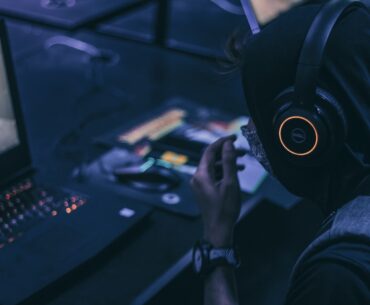 man playing on gaming lapto p