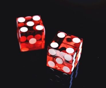 two red-and-white dices