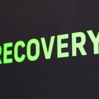 a close up of a sign that reads recovery