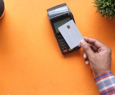 person holding black and white electronic device