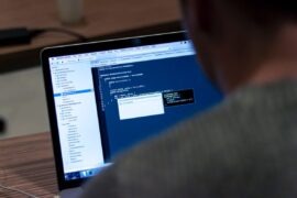How to Obtain CCNP Data Center Certificate? person facing tuned on MacBook Pro