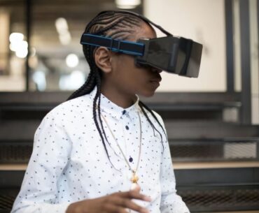 5 Technology Trends to Watch in 2023 a woman wearing a pair of virtual glasses