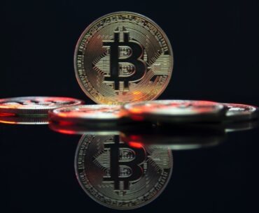 How to Store Your Bitcoin Safely and Securely a bit coin sitting on top of a table