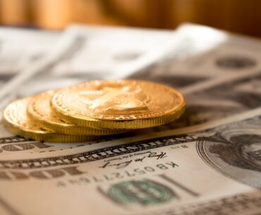 4 Passive Income Opportunities to Help You Make Money three round gold-colored coins on 100 US dollar banknotes