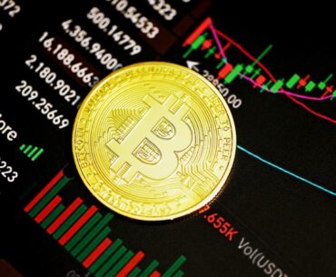 The Banking Evolution: The Influence of WBTC gold round coin on black surface