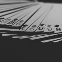 grayscale photo of a fanned playing card