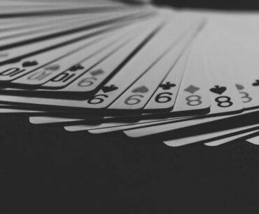 grayscale photo of a fanned playing card