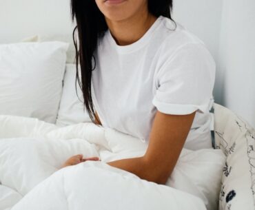 Women And Their Sexual Fantasies: Is It Healthy woman sitting on bed