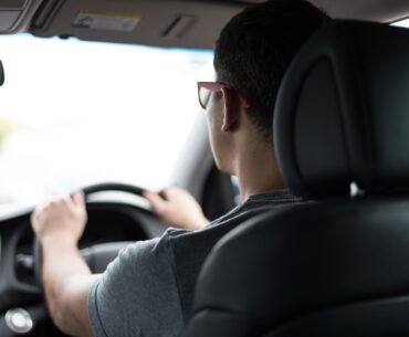 man driving car during daytime