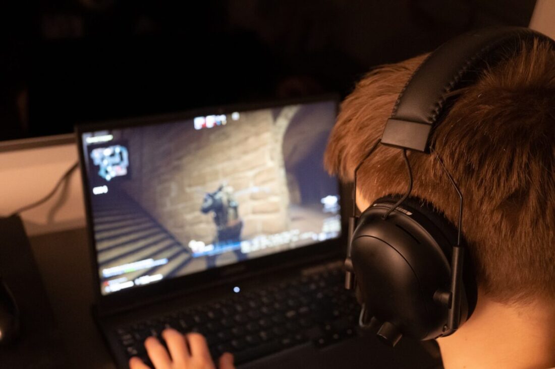 Exploring the Exciting New Features of Counter-Strike 2 Black Headphones on Black Laptop Computer
