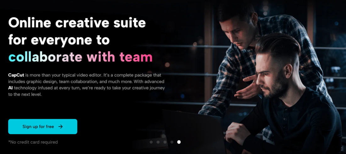 A person and person looking at a computer Description automatically generated