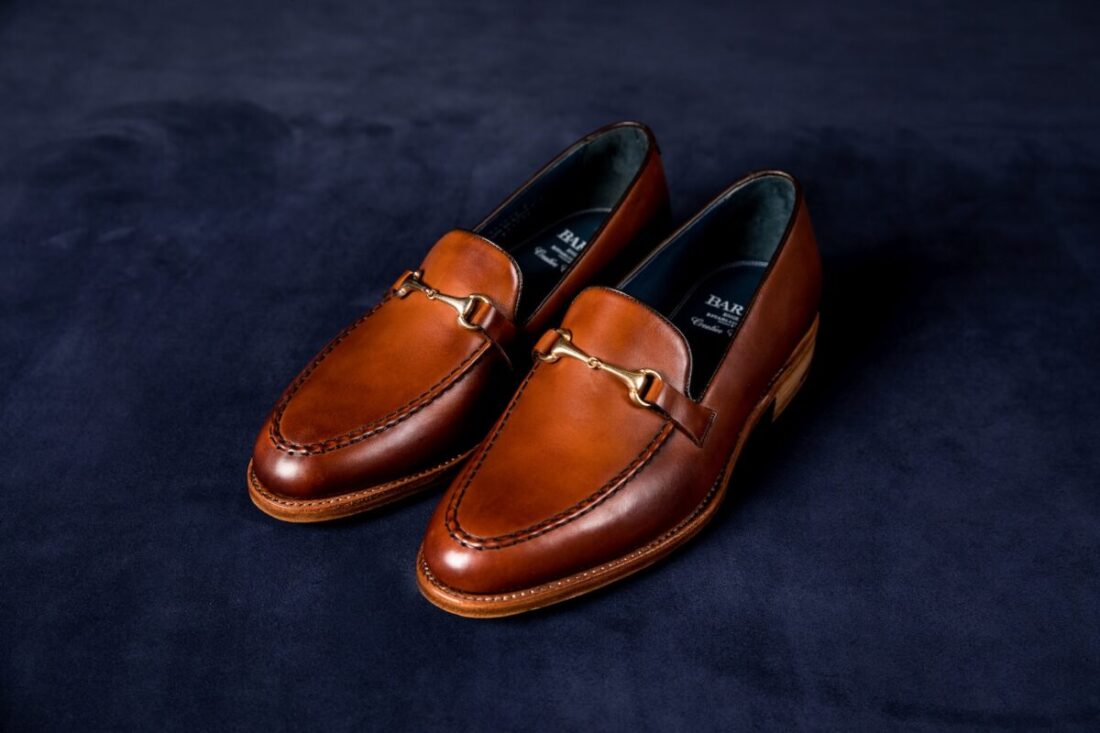 Exquisite Handcrafted Men’s Leather Shoes: Unparalleled Luxury brown leather loafers on blue textile