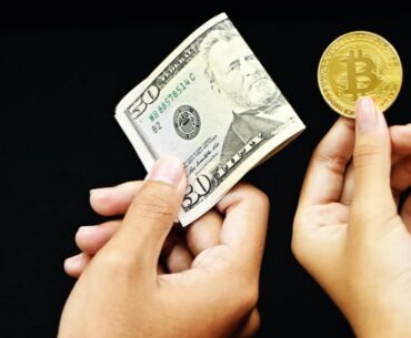 How Cryptocurrency Is Integrated in Online Gambling? person holding 20 us dollar bill