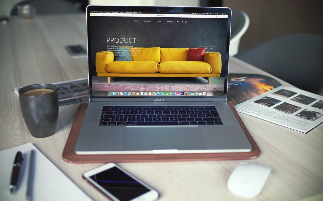 A computer on a table Description automatically generated