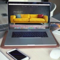 A computer on a table Description automatically generated