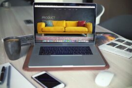 Everything to Know Before Outsourcing Mobile Web App Development A computer on a table Description automatically generated
