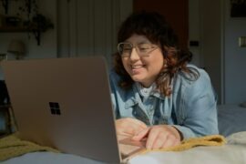 Monkey App: A Fun and Interactive Video Chat Platform Like CooMeet a woman in glasses is looking at a laptop