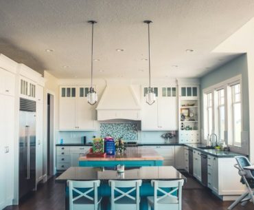 How to Turn Your Dream Home into a Reality Without Breaking the Bank kitchen with island and table