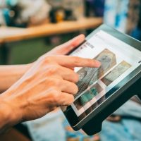 a person holding a tablet