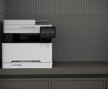 The Benefits of Cloud Faxing for Businesses a white printer on a shelf