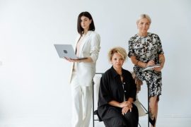 Easy Onboarding and Updates: No IT Department Required A diverse group of professional women posing confidently in a modern office setting.