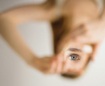 Skills Tests and Evolutionary Psychology: Survival Instincts in Assessment woman holding mirror