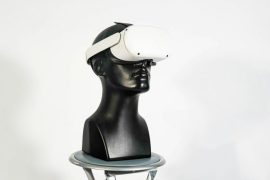 a black mannequin head with a white hat on top of it