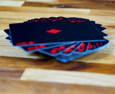 Spider Solitaire by Easybrain: Designed for Players Who Enjoy Deep Thinking black and red star print textile