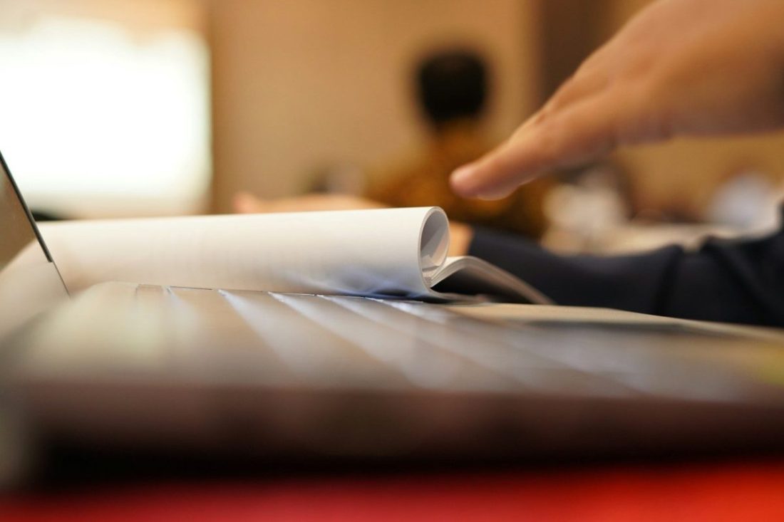 a close-up of a person reading a book