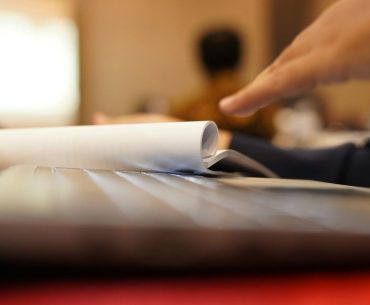 Mastering IT Certification Preparation with Practice Platforms: A Practical Guide for Success a close-up of a person reading a book