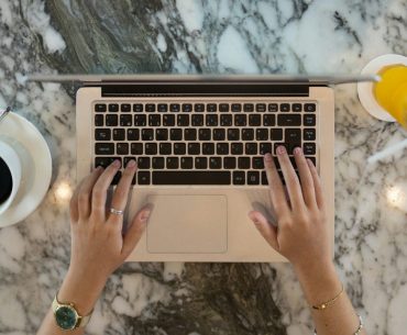 A Complete Roadmap to Cracking IT Certifications with Online Study Platforms hands holding a laptop