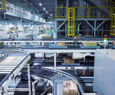 Benefits of PLC Systems: Why Industries Depend on Automation Controllers a factory filled with lots of machines and boxes