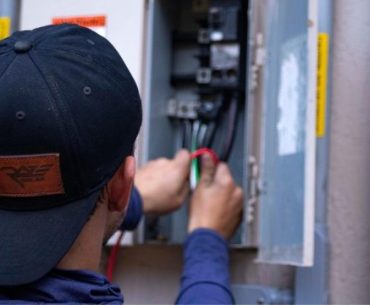 Sudden Outage? How to Secure a Rush Commercial Electrical Panel Upgrade Fast a man using a machine