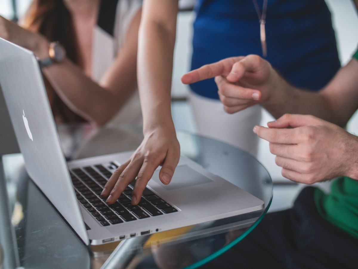 8 Best Compliance Automation Platforms Reviewed 2026 person touching and pointing MacBook Pro